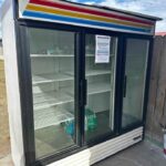 3 glass door fridge with red, yellow, blue stripes on top