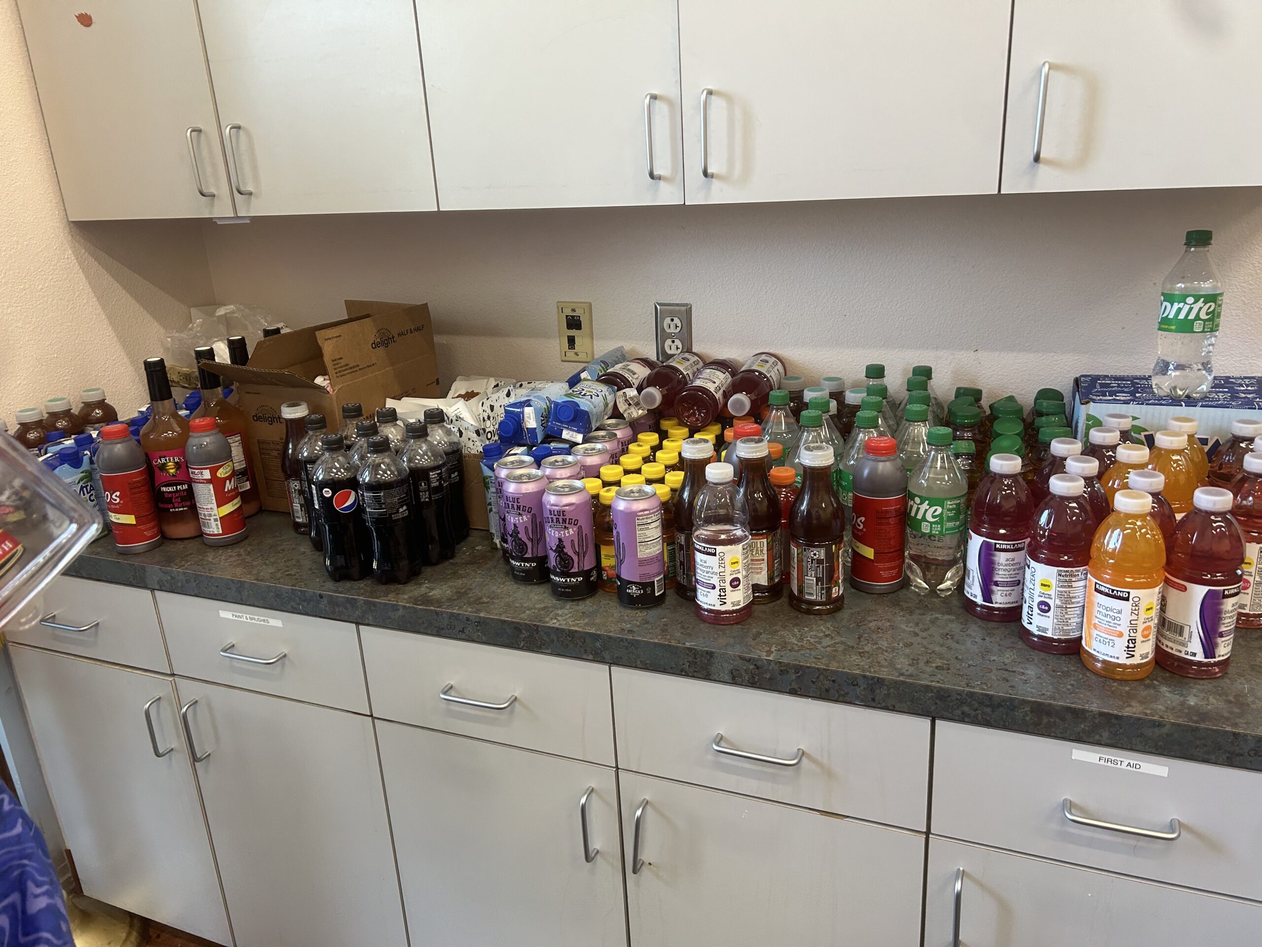 F3F17326-AA40-4217-BEB3-CB56C08EE2F6 bottle of juices and sodas on counter