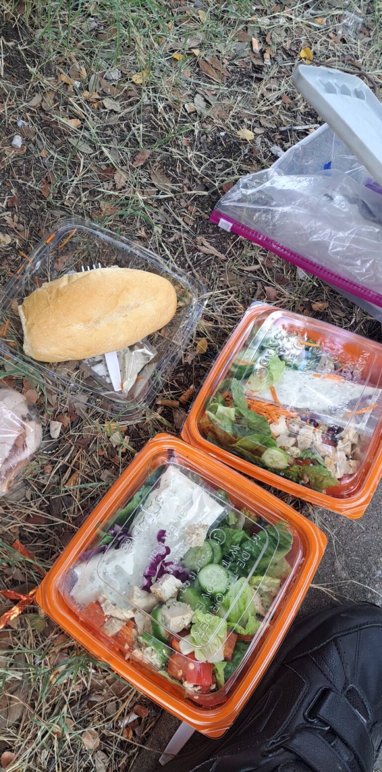 bowls of salad, loaf of bread