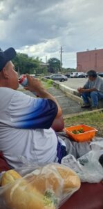 524949544_10231268975567847_7042533299318956256_n man drinking canned drink with orange bowl of salad